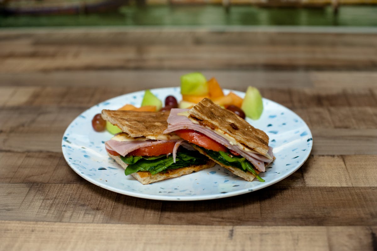 a sandwich sitting on top of a wooden table